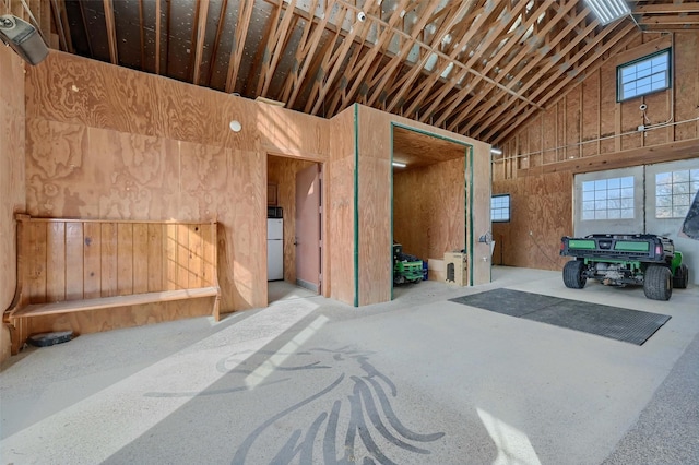 misc room with plenty of natural light and high vaulted ceiling