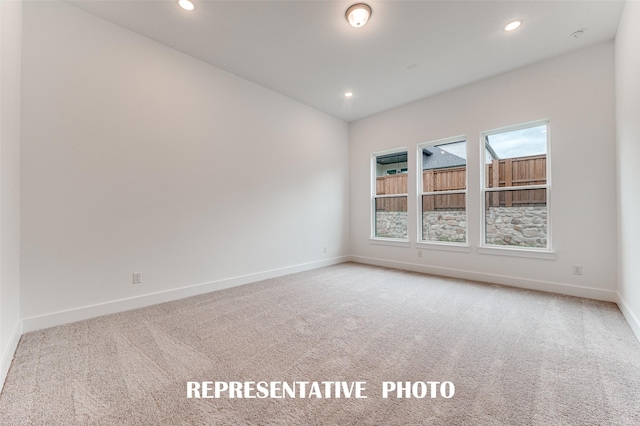 spare room with carpet flooring