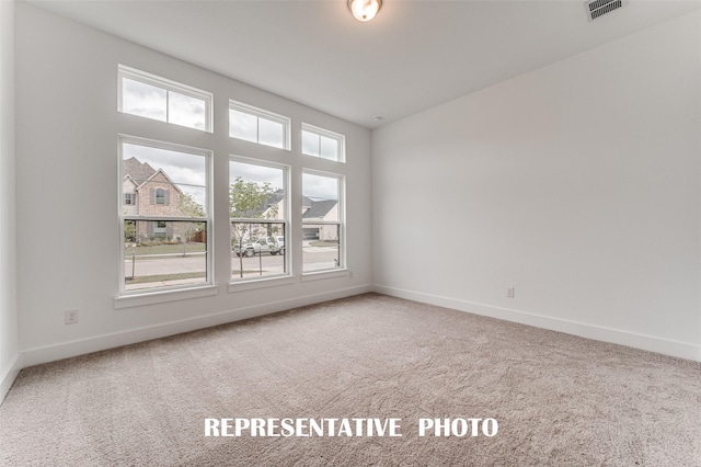 unfurnished room featuring carpet floors