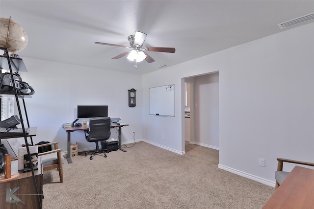 carpeted office with ceiling fan