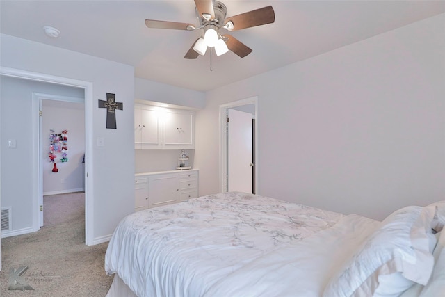 bedroom featuring ceiling fan and light colored carpet