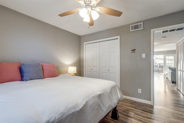 bedroom featuring ceiling fan, a closet, and dark hardwood / wood-style floors