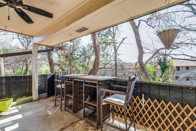 wooden deck with ceiling fan