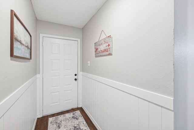 entryway with dark hardwood / wood-style flooring