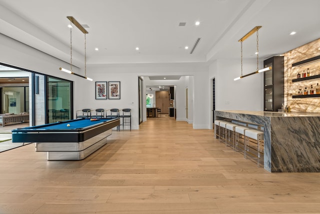 game room with light hardwood / wood-style floors and billiards