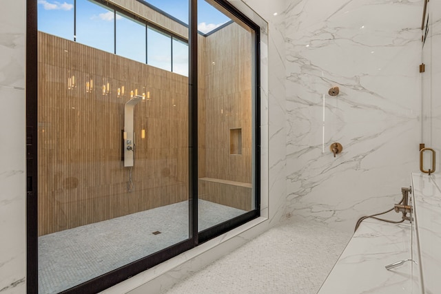 bathroom featuring a shower with door