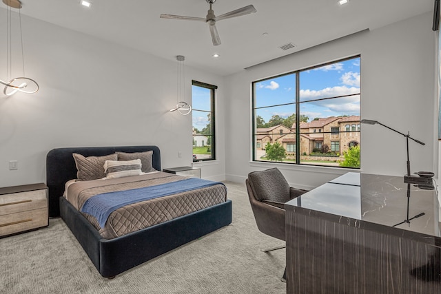 carpeted bedroom with ceiling fan