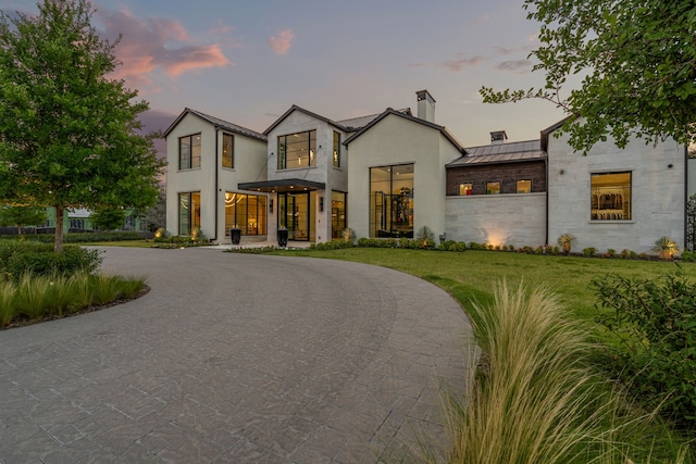 view of front of house with a yard