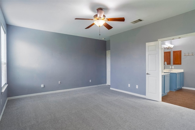 unfurnished room featuring light carpet and ceiling fan