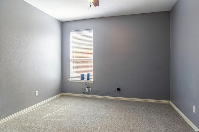 carpeted empty room with ceiling fan