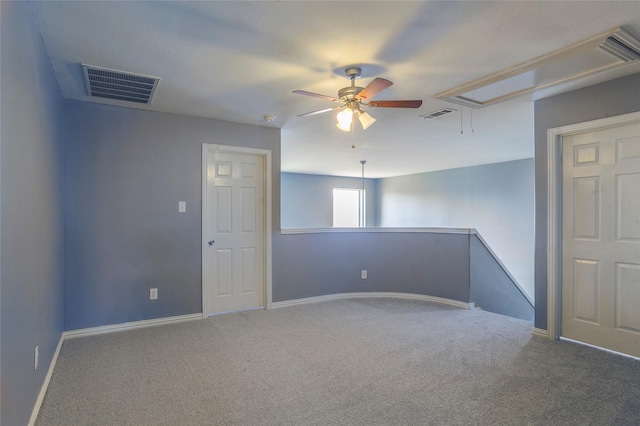 empty room with ceiling fan and carpet flooring