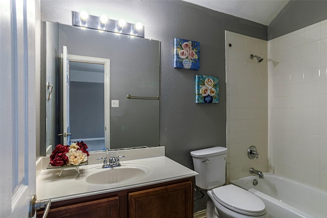 full bathroom with shower / bathtub combination, toilet, vanity, and lofted ceiling