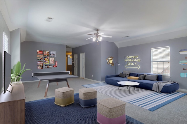 interior space featuring vaulted ceiling and ceiling fan
