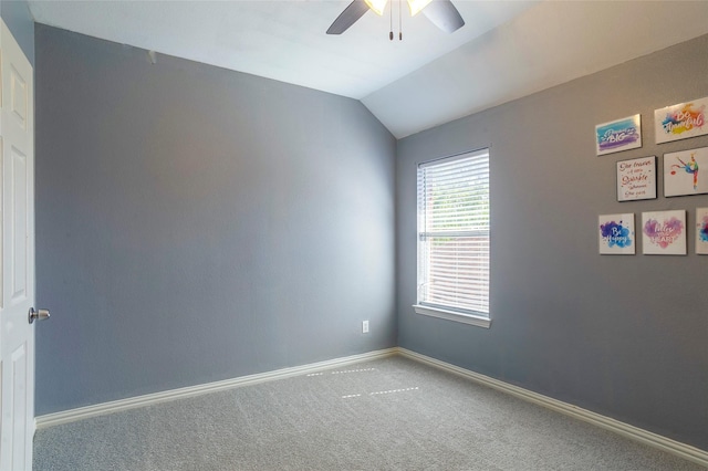 unfurnished room with ceiling fan, lofted ceiling, and carpet floors