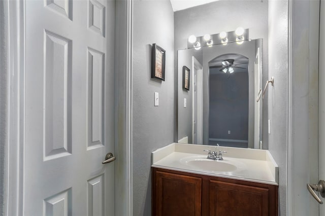 bathroom with ceiling fan and vanity