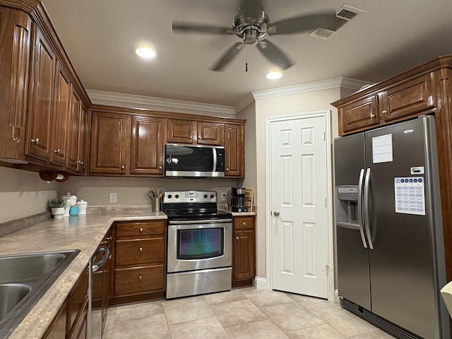 kitchen featuring stainless steel appliances, sink, light tile patterned flooring, ceiling fan, and crown molding