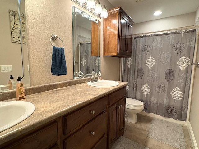 bathroom with toilet, vanity, and a shower with shower curtain