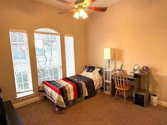 bedroom featuring ceiling fan, carpet, and multiple windows