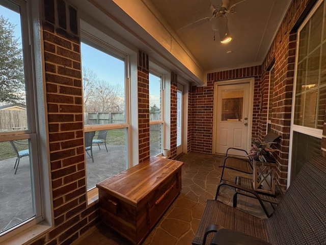 sunroom with ceiling fan