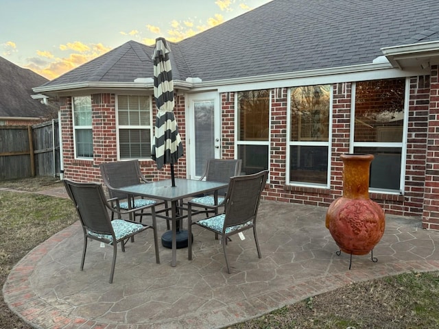 view of patio terrace at dusk