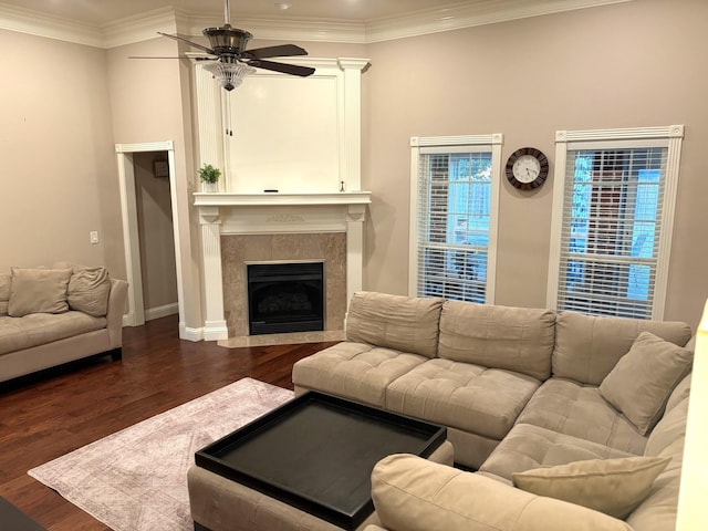 living room with ceiling fan, dark hardwood / wood-style flooring, and crown molding