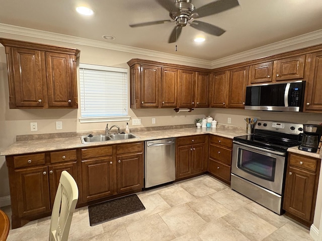 kitchen with ceiling fan, sink, crown molding, and stainless steel appliances