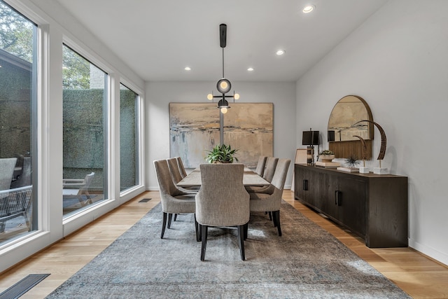 dining room featuring recessed lighting, light wood-style flooring, baseboards, and visible vents