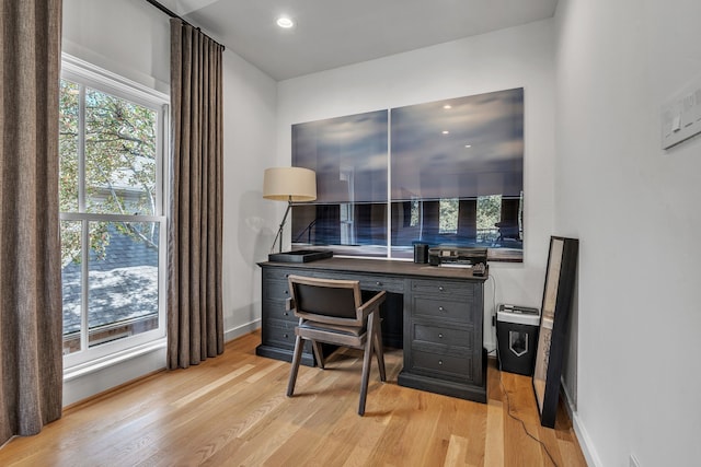 home office with recessed lighting, baseboards, and light wood-style floors