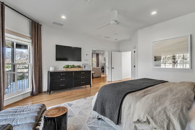 bedroom with ceiling fan and light wood-type flooring