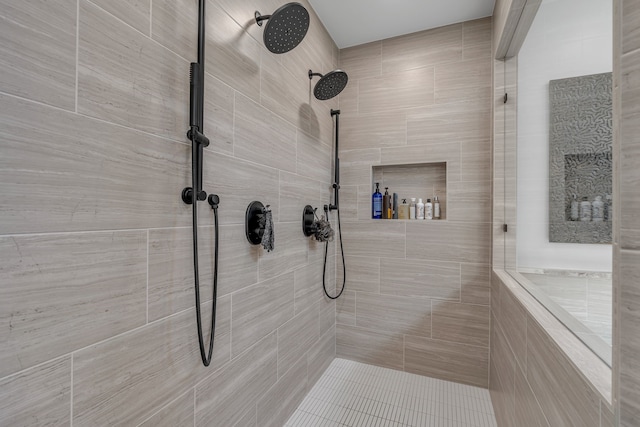 full bath featuring tiled shower