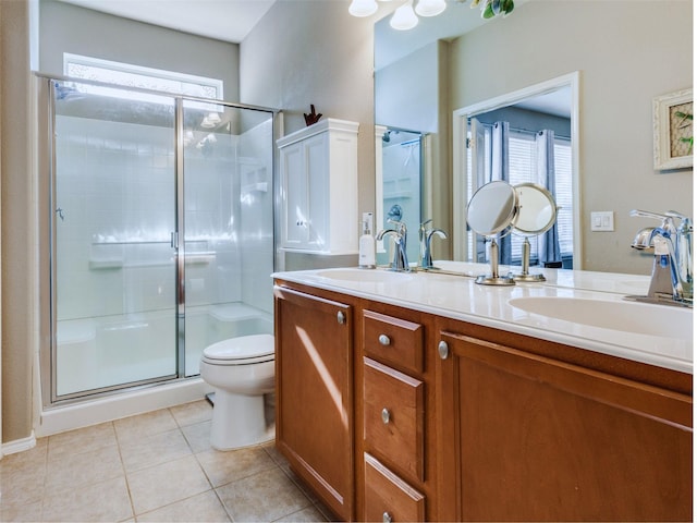 bathroom featuring toilet, tile patterned floors, a healthy amount of sunlight, and a shower with shower door