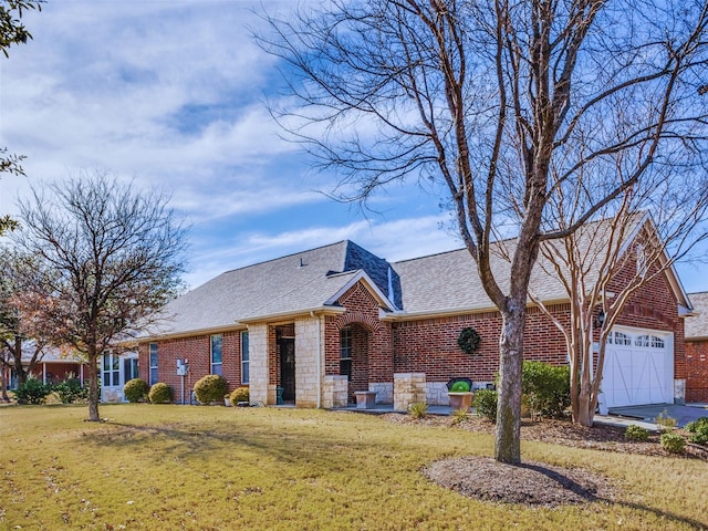 view of front facade featuring a garage and a front lawn