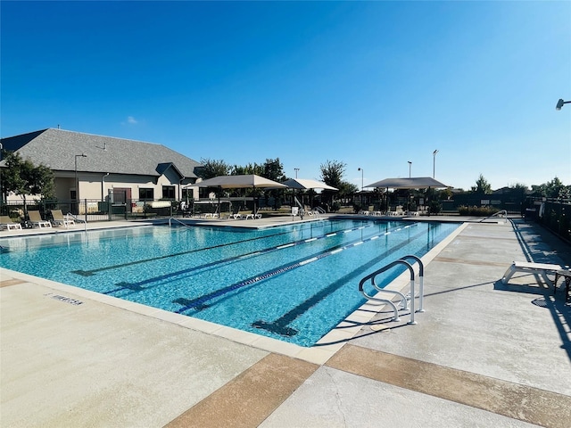 view of swimming pool featuring a patio area