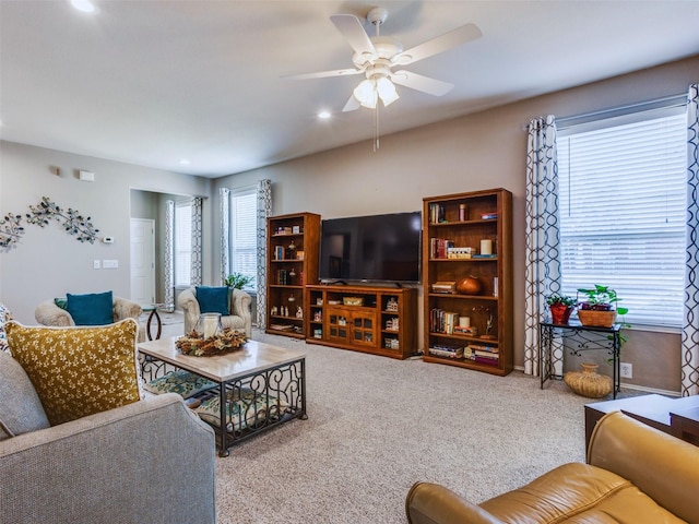 living room featuring ceiling fan and carpet flooring