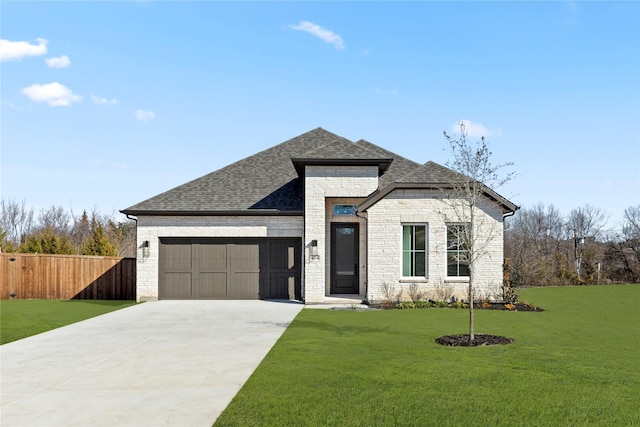 view of front of home featuring a front lawn and a garage