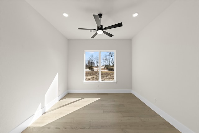 unfurnished room featuring light wood-type flooring, ceiling fan, baseboards, and recessed lighting