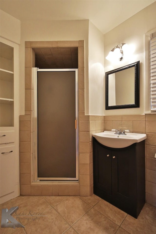 bathroom featuring tile patterned flooring, tile walls, and walk in shower