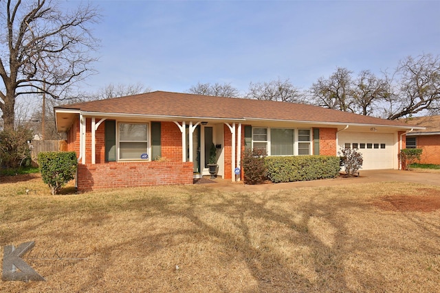 ranch-style home featuring a garage and a front lawn