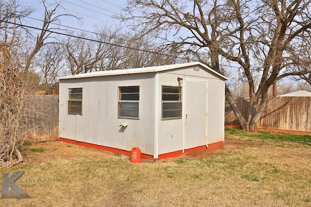 view of outbuilding with a lawn