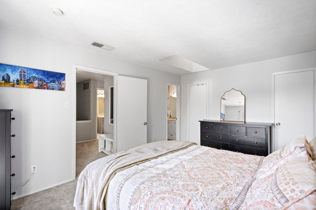 bedroom with carpet and ensuite bath