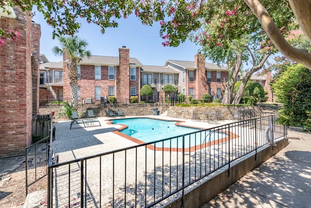 view of swimming pool with a patio