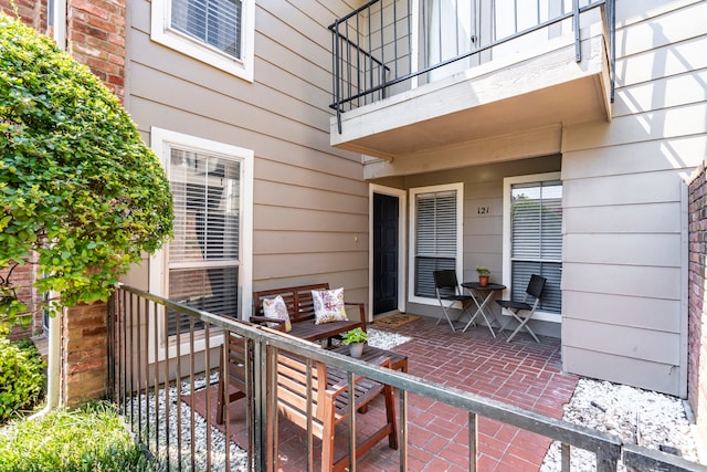 view of patio featuring a balcony