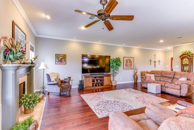 living room with ceiling fan, dark hardwood / wood-style flooring, and ornamental molding