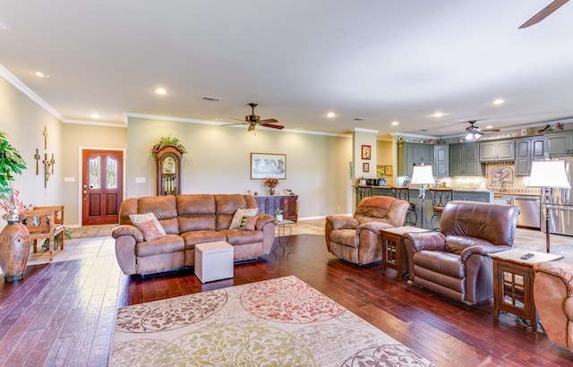 living room featuring ceiling fan, dark hardwood / wood-style flooring, and crown molding