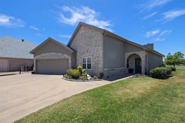 view of front of house featuring a garage and a front lawn