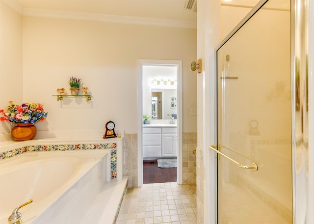 bathroom with vanity, tile walls, tile patterned floors, independent shower and bath, and ornamental molding