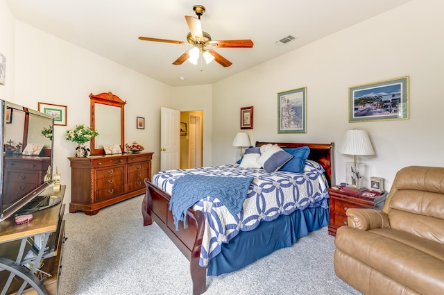 bedroom with ceiling fan and light colored carpet