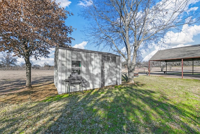 view of outbuilding with a lawn