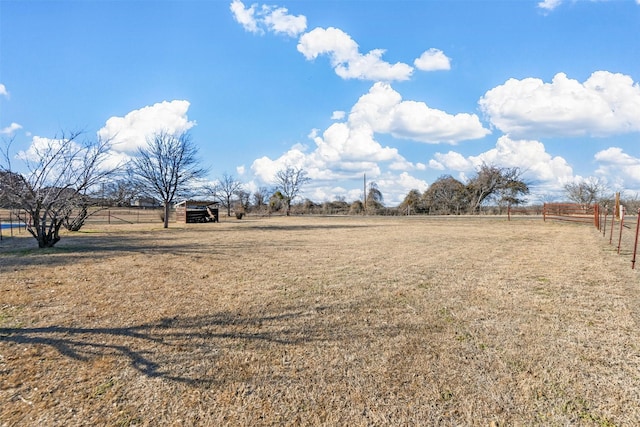 view of yard with a rural view