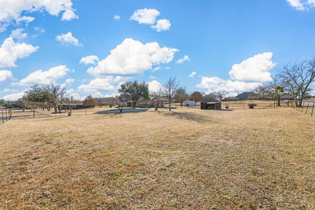 view of yard with a rural view